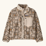Patagonia Kids Retro X Fleece Jacket in snowshoe Hare, Natural. Cream fleece base with a beige and brown tortoiseshell-style pattern, and a cream square chest pocket.