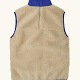 Back of Patagonia kids retro x vest in dark natural showing pile fleece body and blue turned up collar