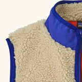 Patagonia kids retro x vest in dark natural showing close up of blue turned up collar