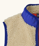 Patagonia kids retro x vest in dark natural showing close up of blue turned up collar