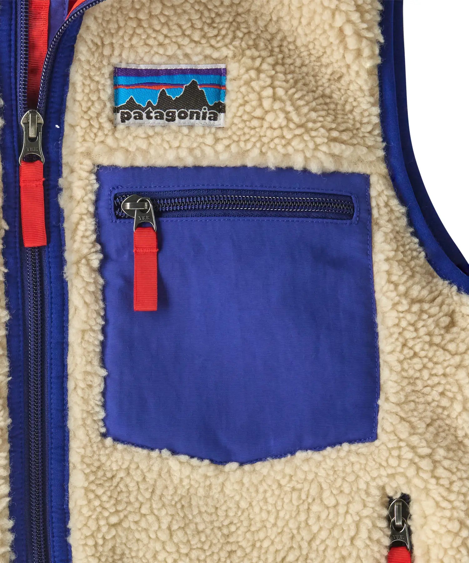 Patagonia kids retro x vest in dark natural showing close up of blue chest pocket with zip fastener