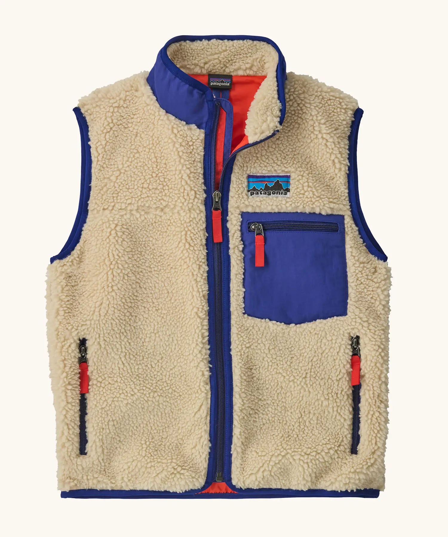 Patagonia kids retro x vest in dark natural. A 100% recycled polyester and pile fleece gilet with dark blue trim. Features a full length zip, 2 side pockets and a small chest pocket