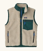 Patagonia kids retro x vest. A 100% recycled polyester and pile fleece gilet with dark green trim. Features a full length zip, 2 side pockets and a small chest pocket