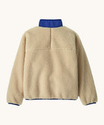 The back of the Patagonia kids retro x jacket in dark natural available at Babipur showing the blue turned up collar detail