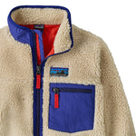 Patagonia kids retro x jacket in dark natural available at Babipur showing the side pocket detail