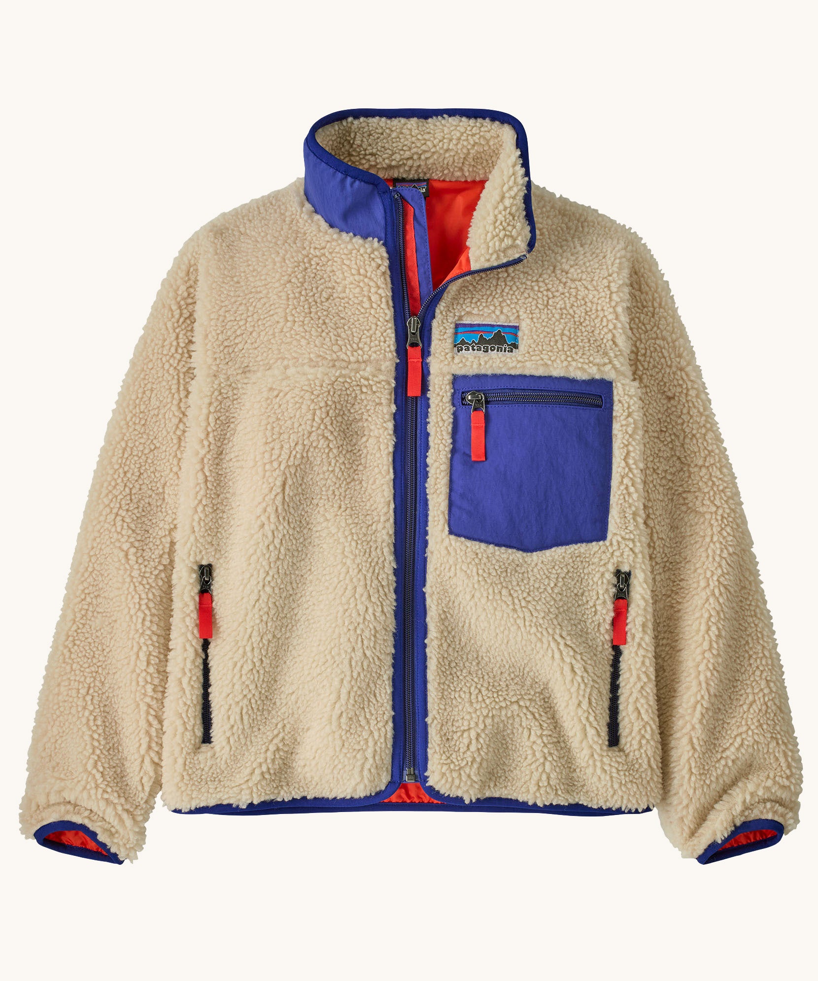 Patagonia kids retro x jacket in dark natural available at Babipur.. A 100% recycled polyester thick pile fleece in cream with blue trim. Features a turn up collar, full length zip , 2 side pockets and a chest pocket.