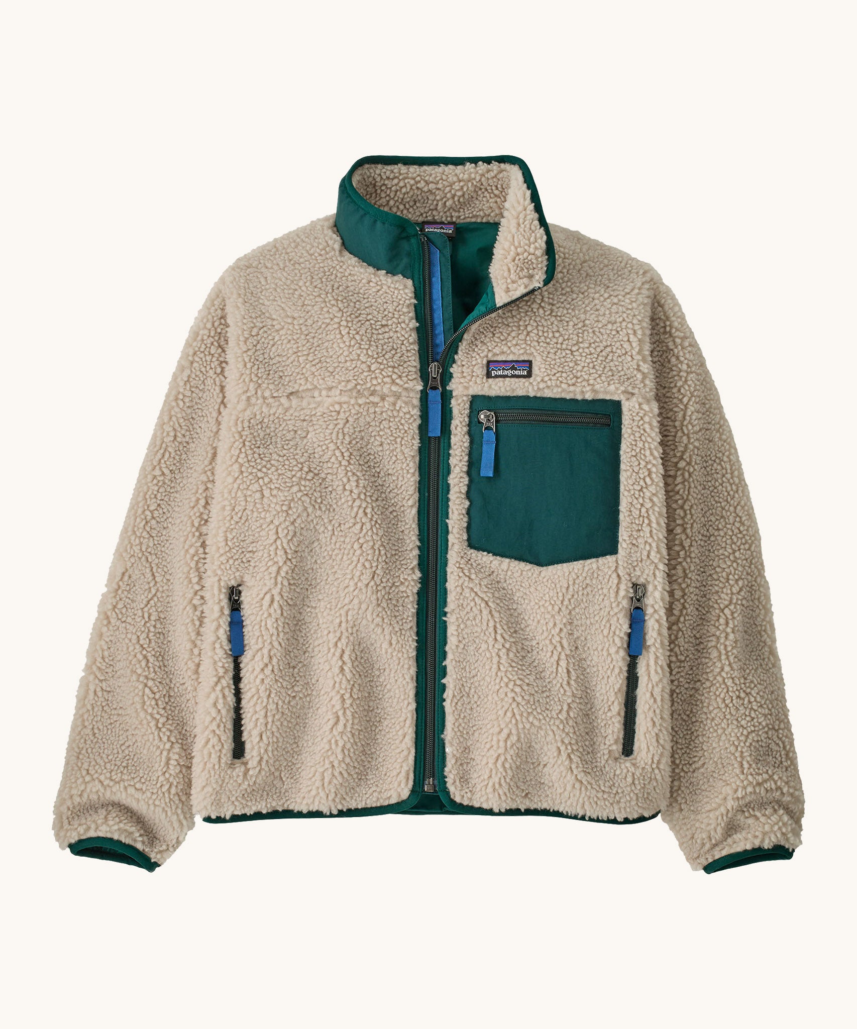 Patagonia kids retro x jacket in dark natural/cascade green available at Babipur.. A 100% recycled polyester thick pile fleece in cream with green trim. Features a turn up collar, full length zip , 2 side pockets and a chest pocket.