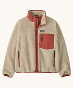 Patagonia kids retro x jacket in dark natural/potters red available at Babipur.. A 100% recycled polyester thick pile fleece in cream with pale red trim. Features a turn up collar, full length zip, 2 side pockets and a chest pocket.