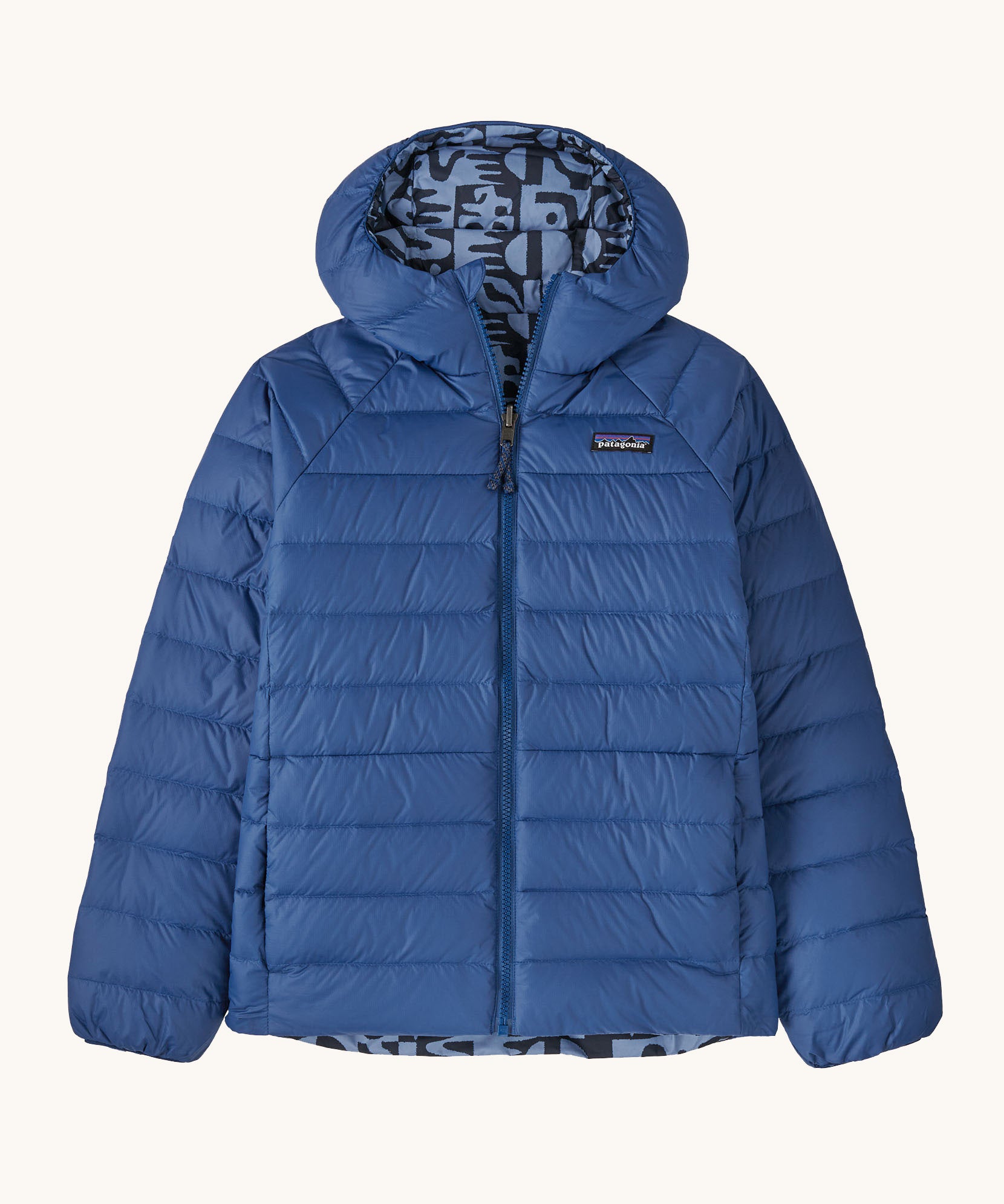 Patagonia Kids Reversible Down Hoody in mother tree sunken blue design available at Babipur. A long sleeve jacket in blue featuring a full length zip and a retro blue shapes on the inside