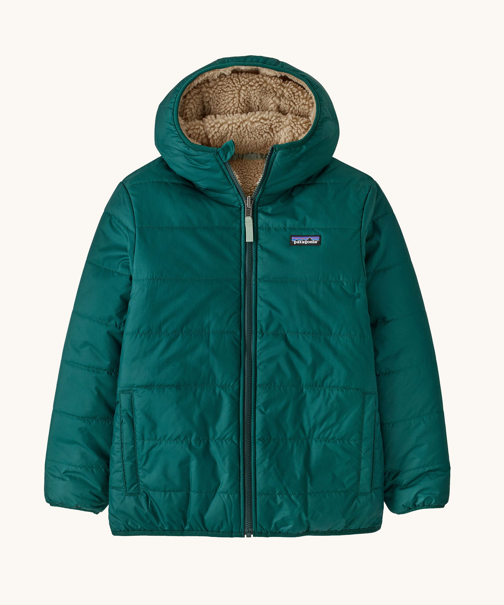 Patagonia kids reversible ready freddy hoody in cascade green available at Babipur. A 100% recycled polyester jacket in green with a thick fleece alternative. Features a full length zip and 2 side pockets. 