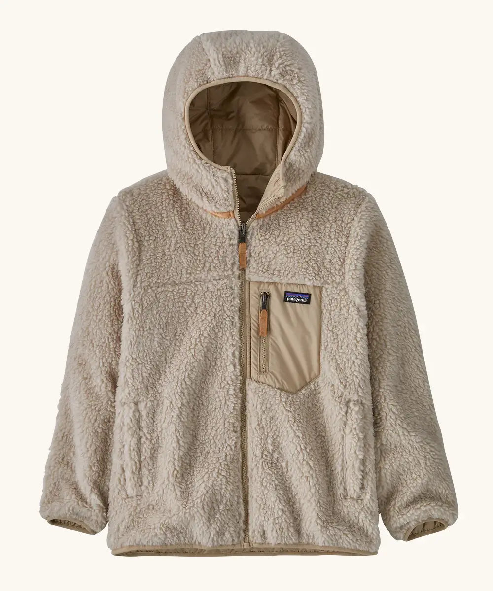 Patagonia kids reversible ready freddy hoody in oar tan shown on the fleece side with beige zipped chest pocket.