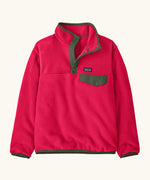 Patagonia Kids Lightweight Synchilla Snap-T Fleece Pullover in Punchy Pink. vibrant raspberry pink body with an army green snap placket and matching chest pocket flap and buttons.
