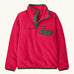 Patagonia Kids Lightweight Synchilla Snap-T Fleece Pullover in Punchy Pink. vibrant raspberry pink body with an army green snap placket and matching chest pocket flap and buttons.