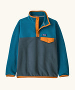 Patagonia Kids Lightweight Synchilla Snap-T Fleece Pullover in Summit Blue. Slate blue bottom half, ocean blue shoulders, sleeves, and collar, with an orange snap placket and matching orange chest pocket flap and buttons.