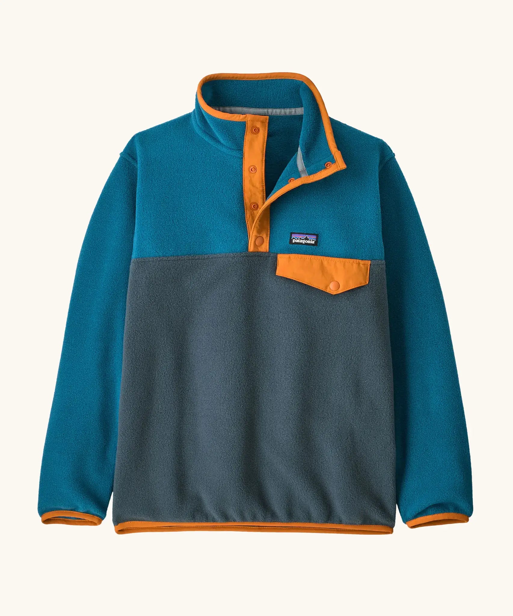 Patagonia Kids Lightweight Synchilla Snap-T Fleece Pullover in Summit Blue. Slate blue bottom half, ocean blue shoulders, sleeves, and collar, with an orange snap placket and matching orange chest pocket flap and buttons.