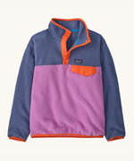 Patagonia kids synchilla pullover fleece in brisk purple. A light fleece in pastel and light purple with orange trim. Features popper fasteners and a chest pocket in yellow