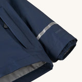 A close up of the cuff on the Patagonia navy torrentshell rain jacket showing the cuff detail