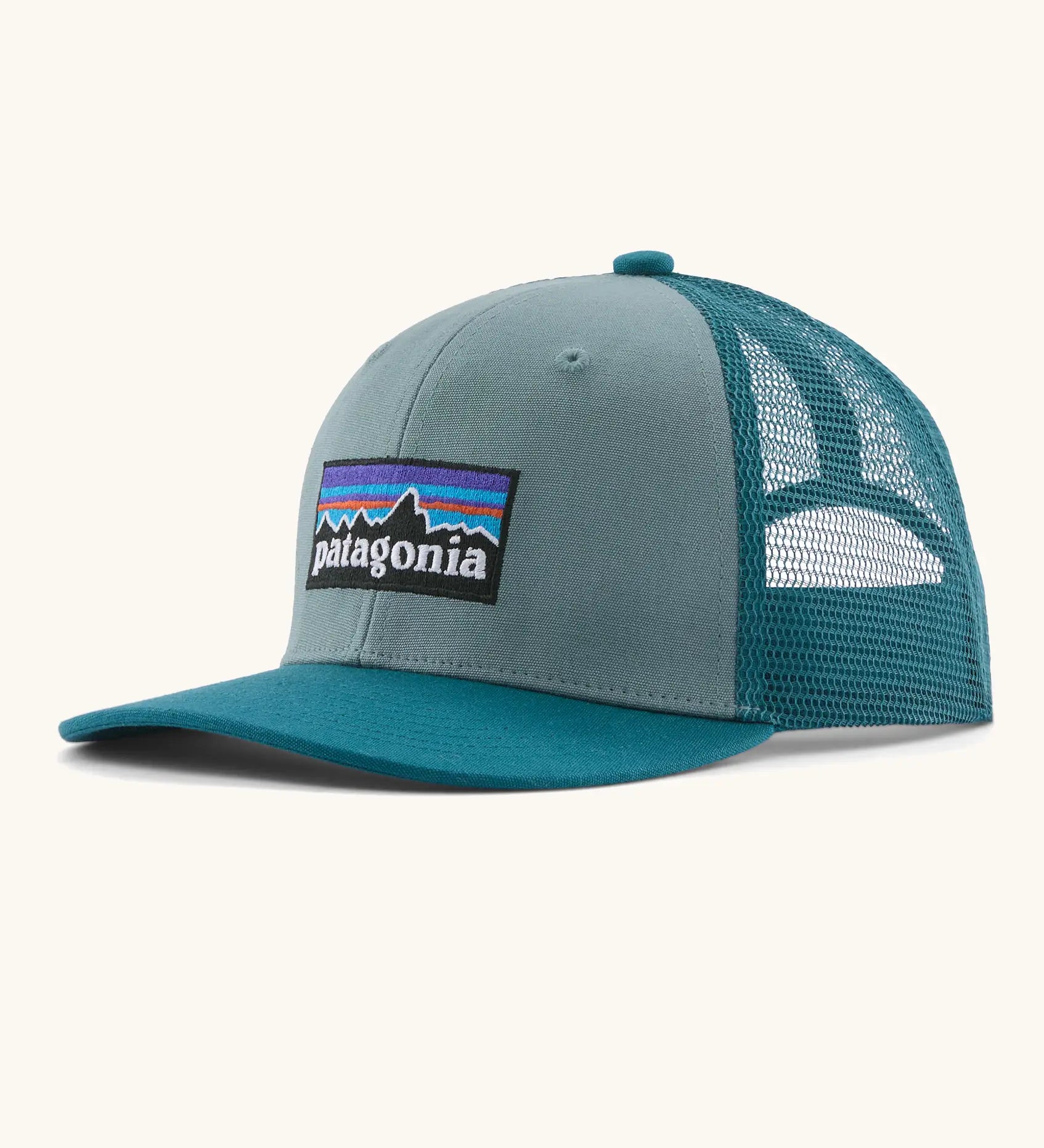 Patagonia kids trucker hat in blue sage. Organic cotton front crown with brand patch and recycled polyester mesh back