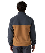 A man wearing and showing the back of the Patagonia mens deer brown synchilla jacket available at Babipur