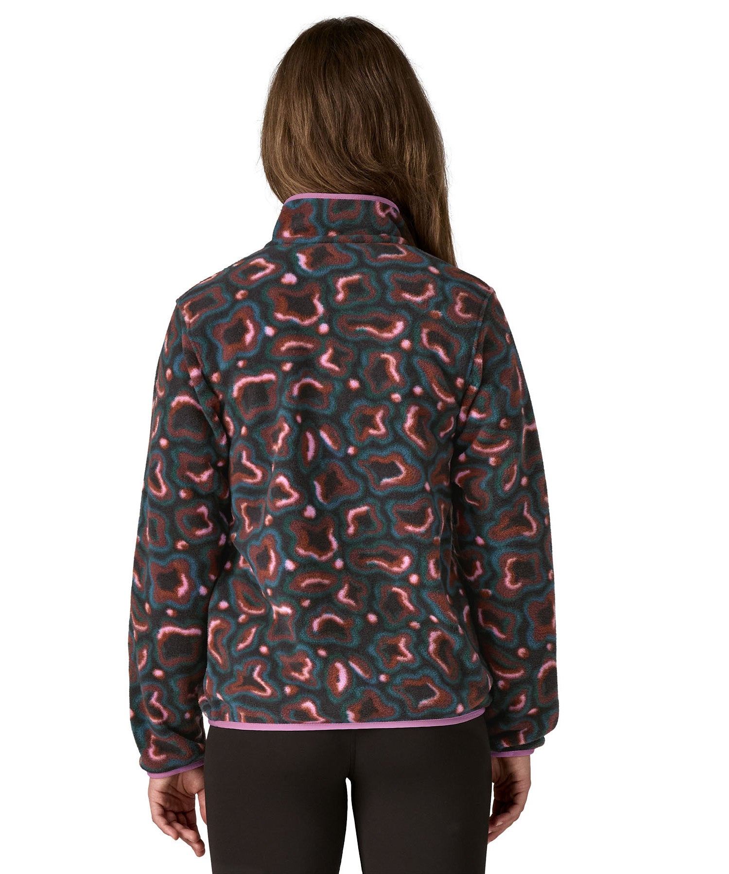 The back of an adult wearing the Patagonia women's synchilla jacket in spirea dried vanilla available at Babipur.
