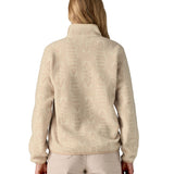 The back of a woman wearing the Patagonia women's synchilla jacket in flow dyno white available at Babipur. 