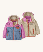Patagonia little kids tribbles hoody. A reversible coat showing a blue and green hooded coat and natural fleece alternative side. Features a small chest pocket and side pockets