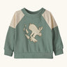 Patagonia 100% organic cotton little kids crew sweatshirt in pale green with beige shoulder panels. Showing a playful rabbit print on the front.