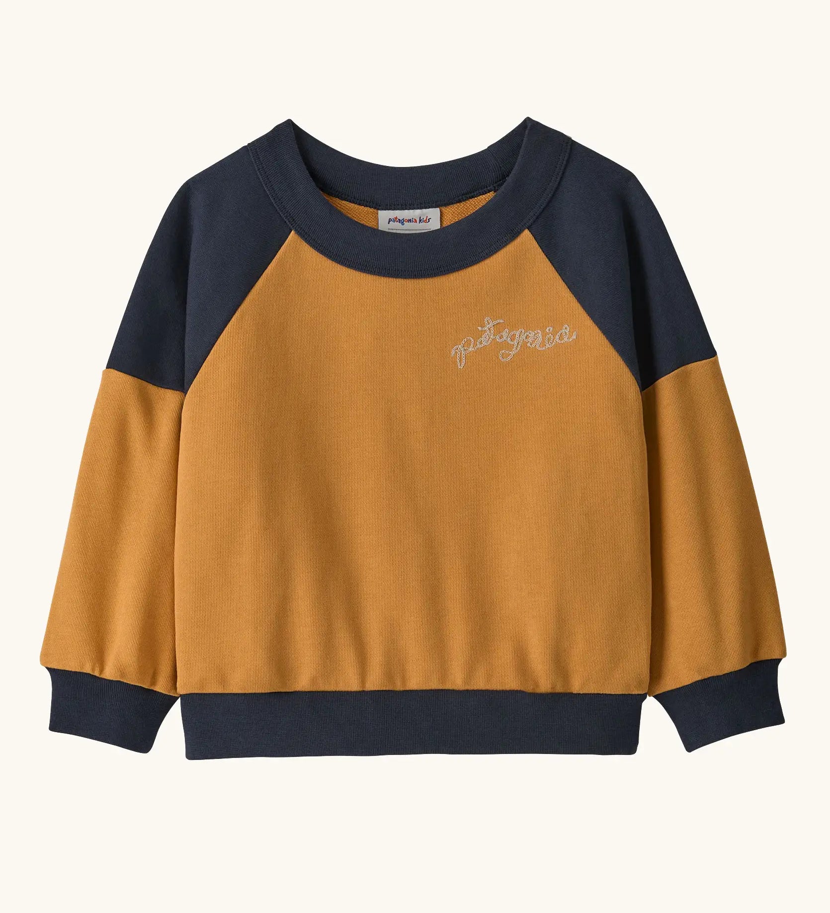 Patagonia 100% organic cotton little kids crew sweatshirt in mustard yellow with navy shoulder panels and brand embroidery on the chest