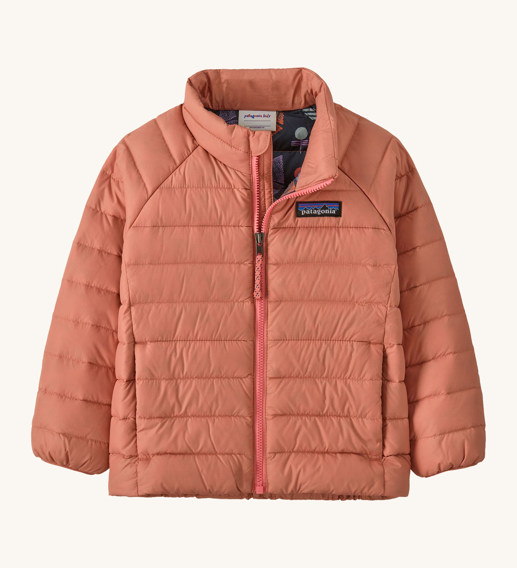 Patagonia little kids down sweater in moment pink. A 100% recycled down jacket in pale pink. Features a padded collar and full length zip