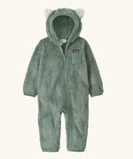Patagonia 100% recycled polyester little kids high pile fleece hooded all in one suit in pale green with bear cub ears front zip and pocket
