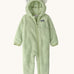 Patagonia little kids furry fiends bunting suit in lichen green available at Babipur. A 100% recycled polyester thick fleece all in one in pastel green with white bear like ears on the hood. Features a full length zip  , elasticated cuffs and a small chest pocket