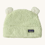 Patagonia little kids friends hat in lichen green available at Babipur. A 100% polyester fluffy beanie in pale green with white bear like ears on top.