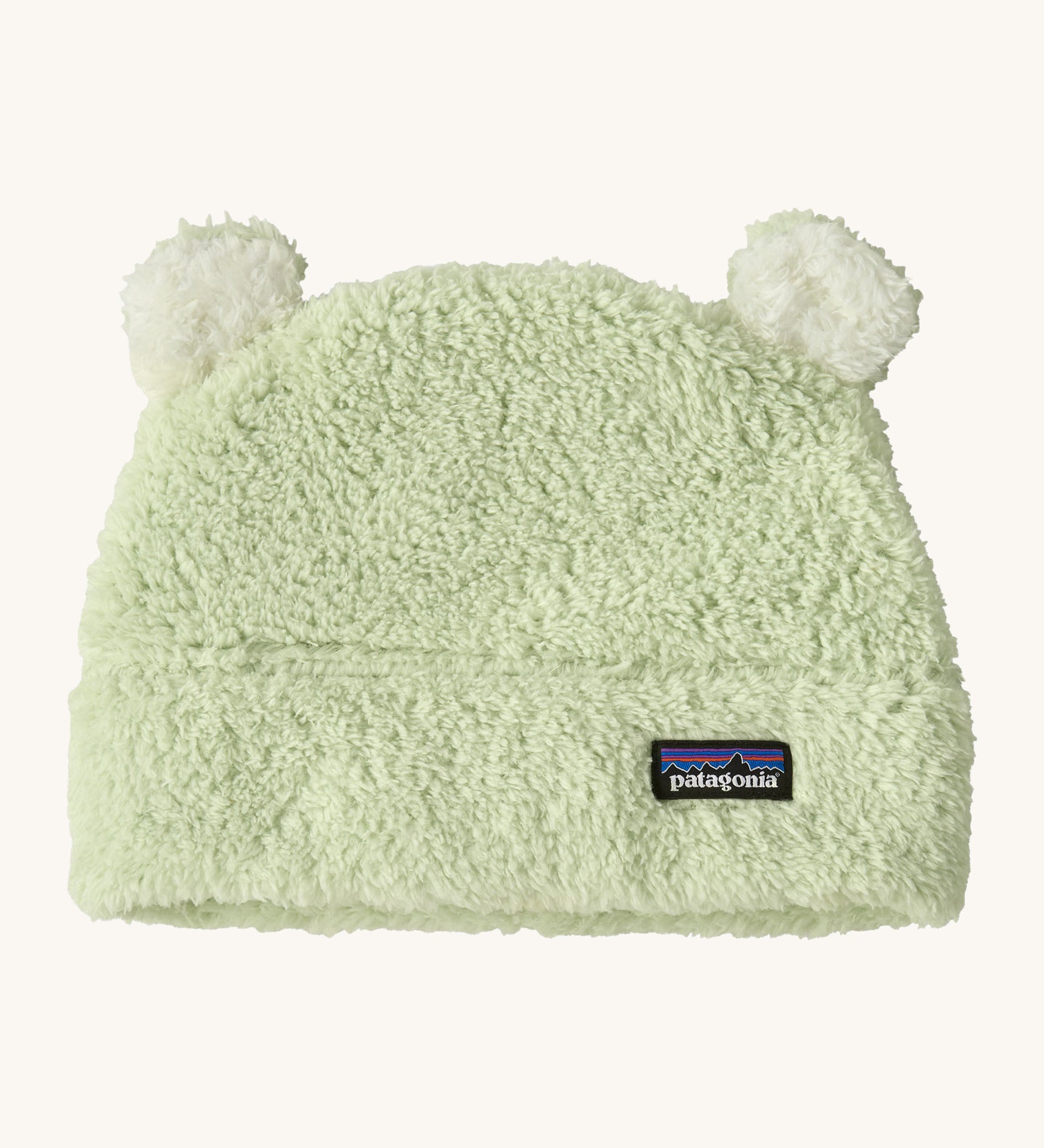 Patagonia little kids friends hat in lichen green available at Babipur. A 100% polyester fluffy beanie in pale green with white bear like ears on top.