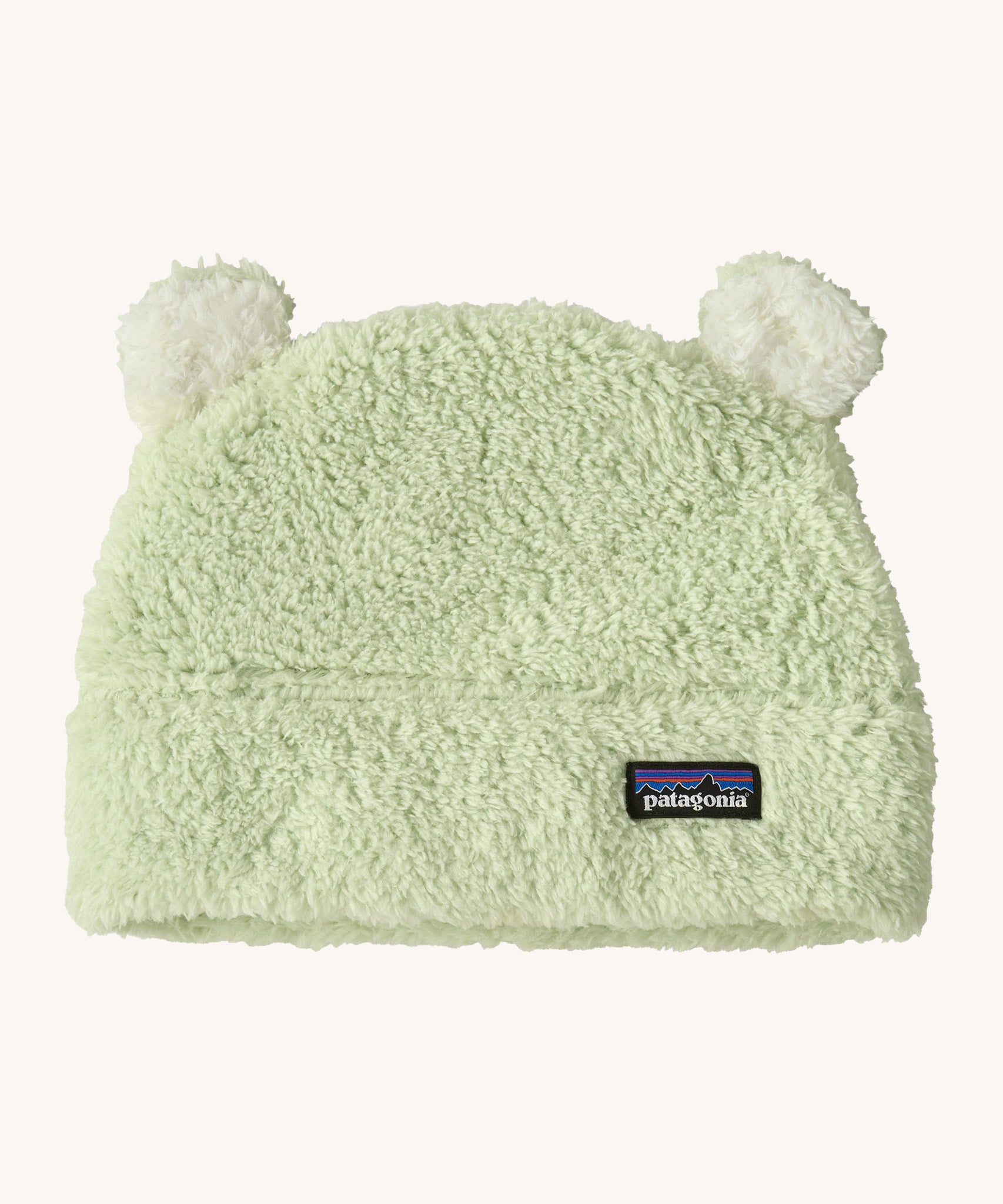 Patagonia little kids friends hat in lichen green available at Babipur. A 100% polyester fluffy beanie in pale green with white bear like ears on top.