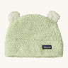 Patagonia little kids friends hat in lichen green available at Babipur. A 100% polyester fluffy beanie in pale green with white bear like ears on top.