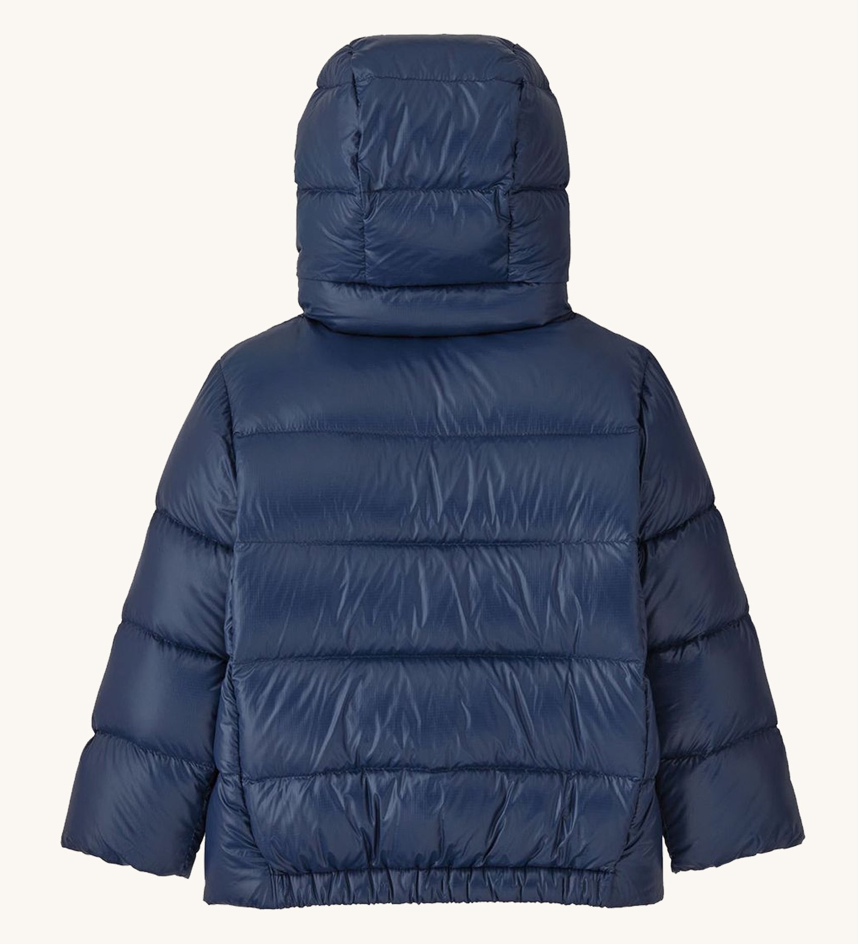 Back of Patagonia little kids hi-loft down sweater hoody jacket in navy showing quilt through construction stitching and elasticated hem