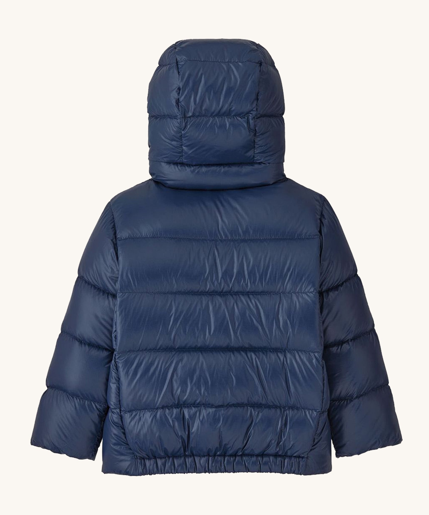 Back of Patagonia little kids hi-loft down sweater hoody jacket in navy showing quilt through construction stitching and elasticated hem