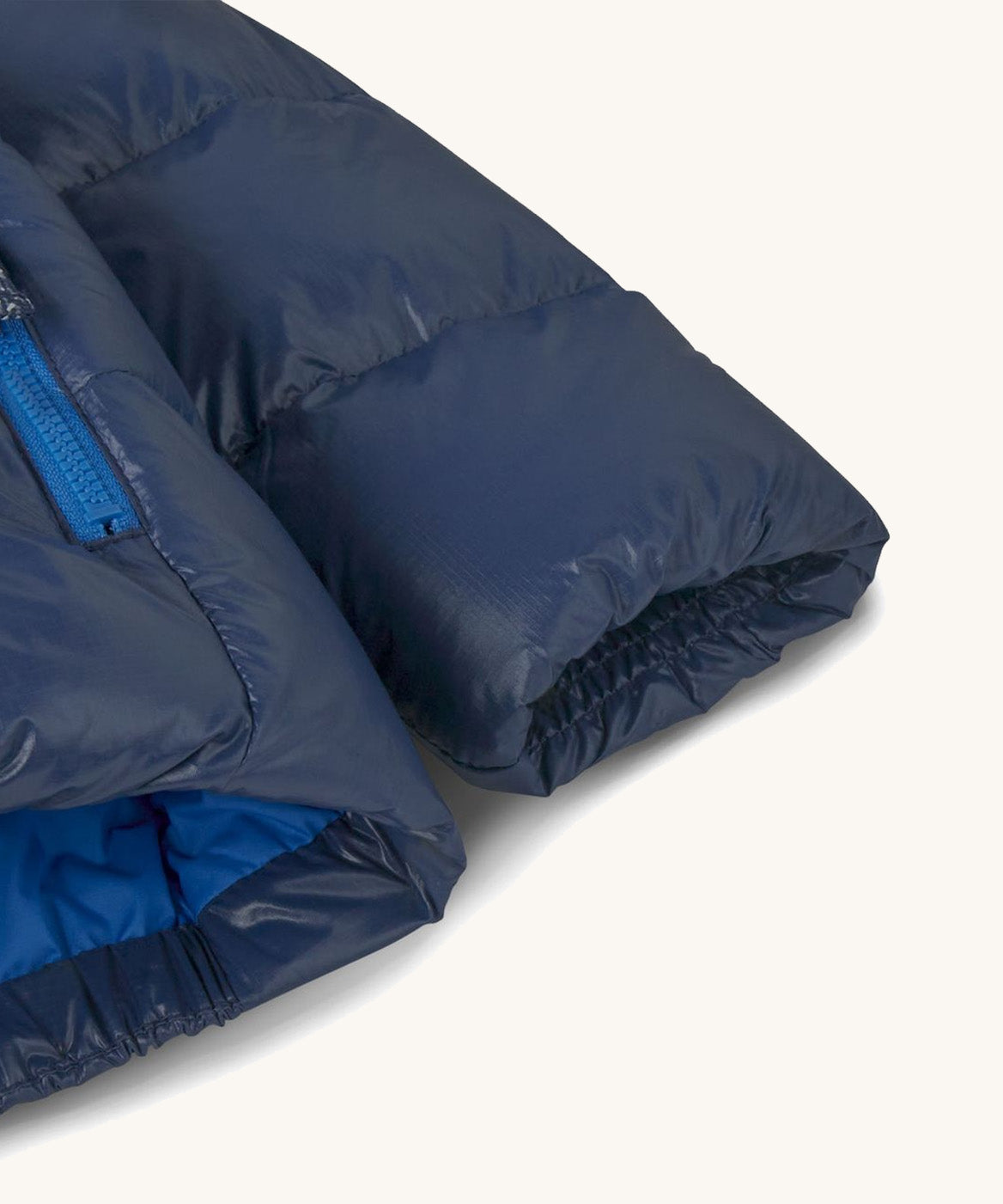 Patagonia little kids hi-loft down sweater hoody jacket in navy showing close up of the cuff and smooth finish on the fabric