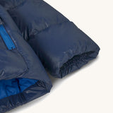 Patagonia little kids hi-loft down sweater hoody jacket in navy showing close up of the cuff and smooth finish on the fabric