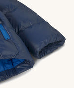 Patagonia little kids hi-loft down sweater hoody jacket in navy showing close up of the cuff and smooth finish on the fabric