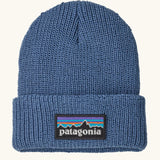 Patagonia little kids knitted beanie in barnacle blue with brand patch on brim. Made from 100% recycled polyester yarn