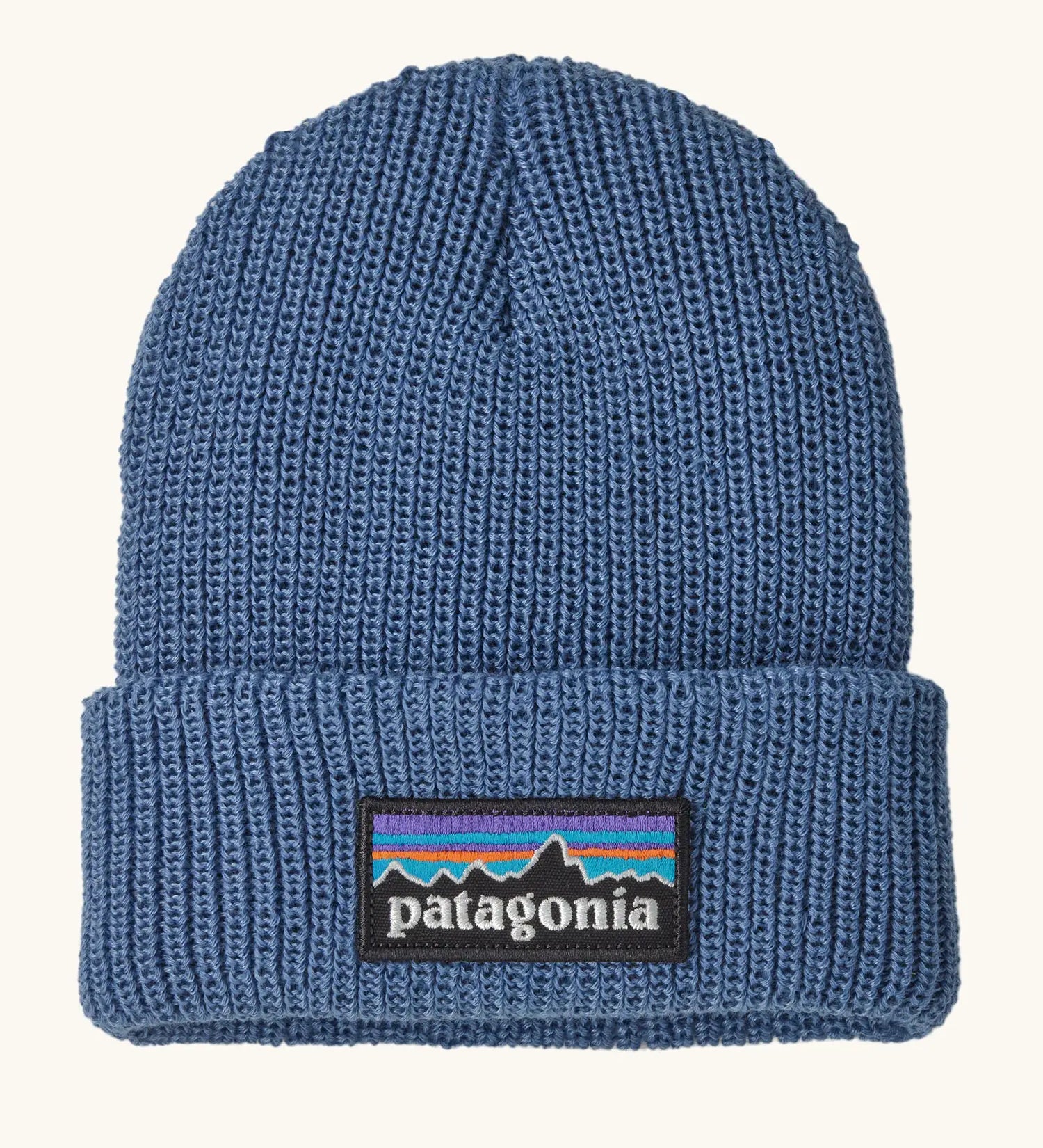 Patagonia little kids knitted beanie in barnacle blue with brand patch on brim. Made from 100% recycled polyester yarn