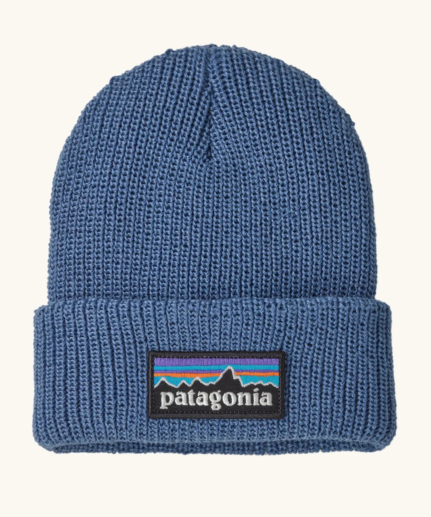 Patagonia little kids knitted beanie in barnacle blue with brand patch on brim. Made from 100% recycled polyester yarn
