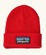 Patagonia little kids knitted beanie in sizzle red with brand patch on brim. Made from 100% recycled polyester yarn