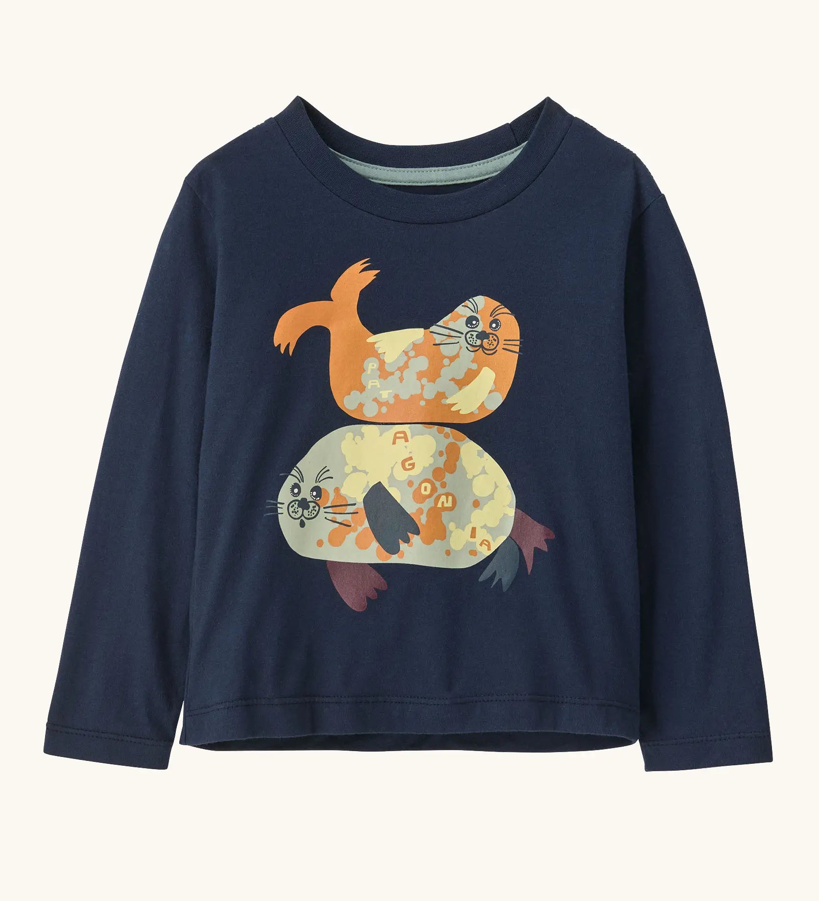 Patagonia 100% organic cotton little kids long sleeve t-shirt in navy with two playful seal prints on the front