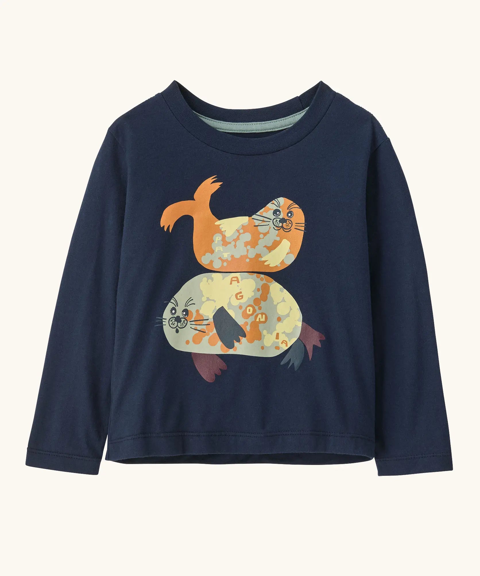 Patagonia 100% organic cotton little kids long sleeve t-shirt in navy with two playful seal prints on the front