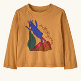 Patagonia 100% organic cotton little kids long sleeve t-shirt in mango orange with a blue mountain goat print on the front. 