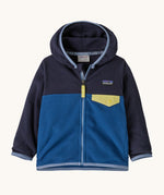 Patagonia little kids micro d snap t jacket in clement blue available at Babipur. A 100% recycled polyester soft fleece hooded jacket in dark navy and blue with light blue trim. Features a full length zip and small chest pocket with a yellow flap