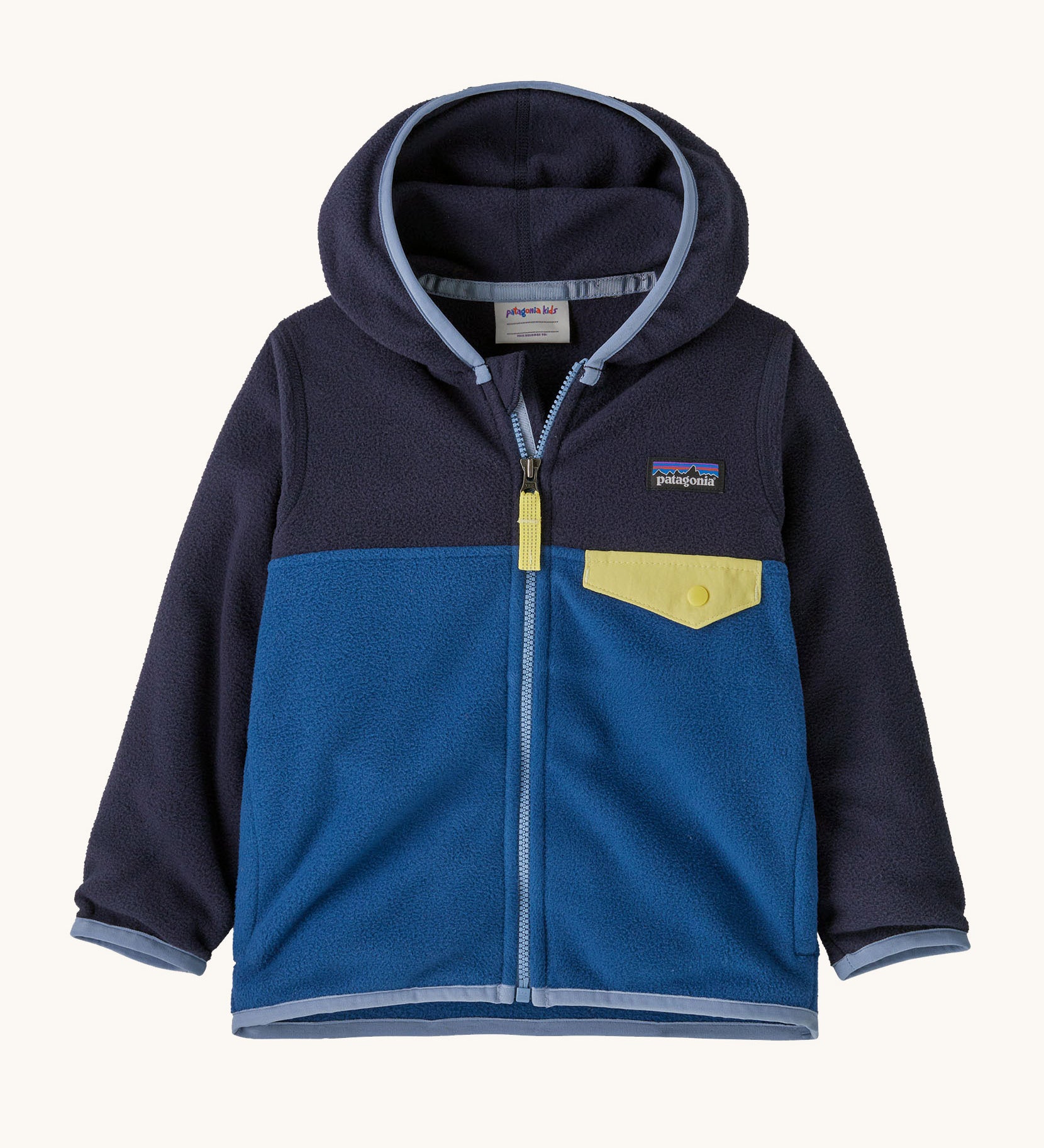 Patagonia little kids micro d snap t jacket in clement blue available at Babipur. A 100% recycled polyester soft fleece hooded jacket in dark navy and blue with light blue trim. Features a full length zip and small chest pocket with a yellow flap