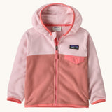 Patagonia little kids micro d snap t jacket in moment pink available at Babipur. A 100% recycled polyester soft fleece hooded jacket in light and dark pink with a matching trim. Features a full length zip and small chest pocket with a pink flap